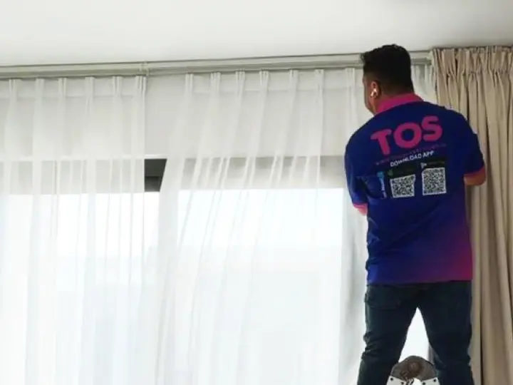 TopOne cleaner with a steam machine at the curtains